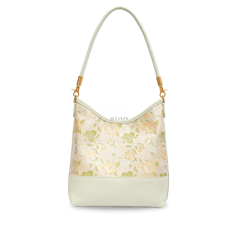 Front view of the Jasmine Green Plum Song Brocade leather shoulder bag with soft green and ivory floral details.