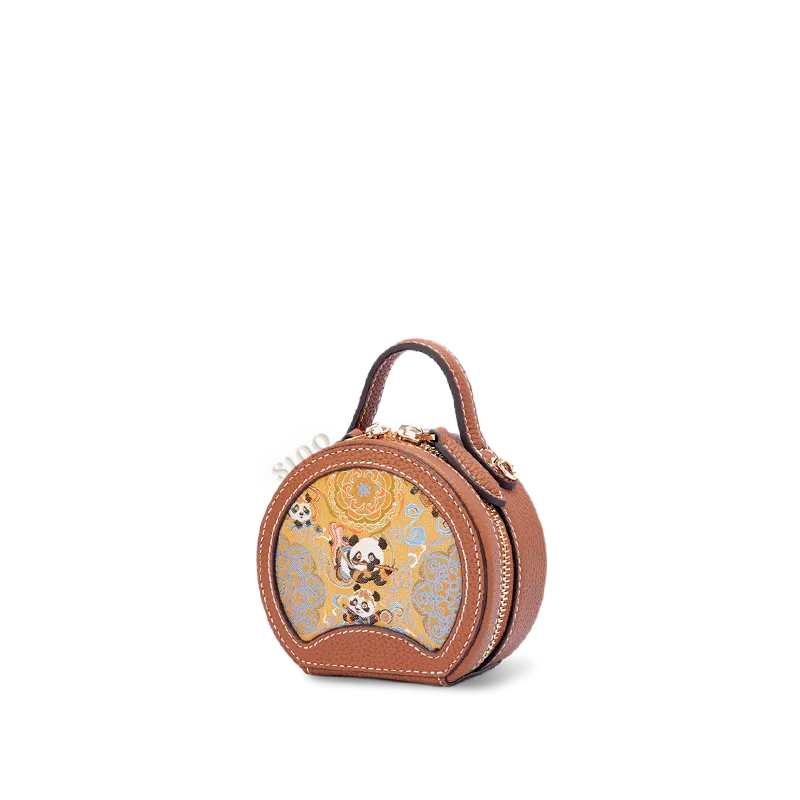 Side view of the Chinoiserie Luxury Song Brocade Joyful Panda Motif mini round bag on white background.