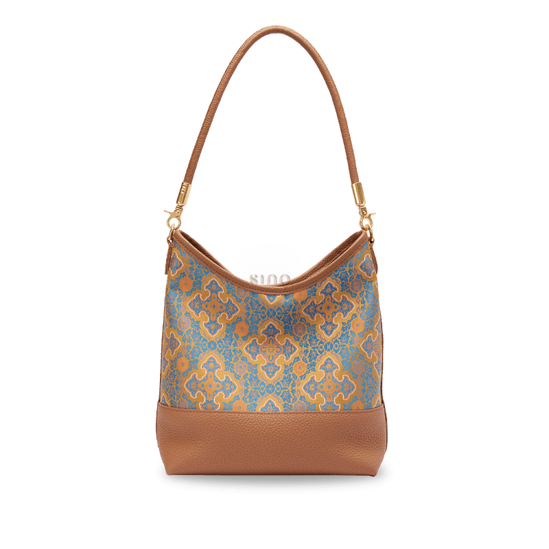 Front view of the Chinoiserie Luxury Song Brocade Ruyi Motif Leather Shoulder Bag with blue and gold brocade and brown leather trim.