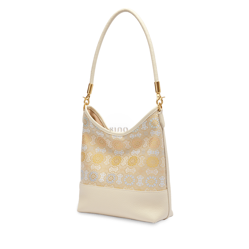 Angled view of the Chinoiserie Luxury Song Brocade Ruyi Victory Leather Shoulder Bag with refined Chinese brocade detailing and ivory leather finish.