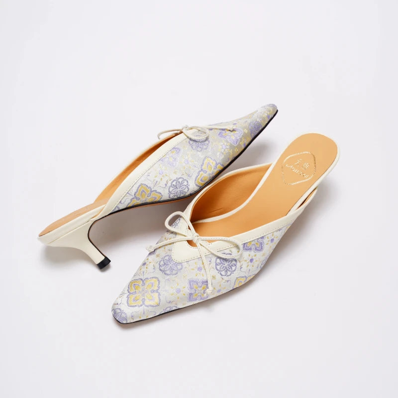 Chinoiserie Shu Brocade mules styled as elegant women's fashion shoes.