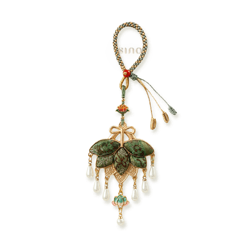 Green Song Brocade pomelo leaf tassel bag charm with layered woven leaves, rose-gold bow, lotus accents, and pearl-like teardrop pendants.