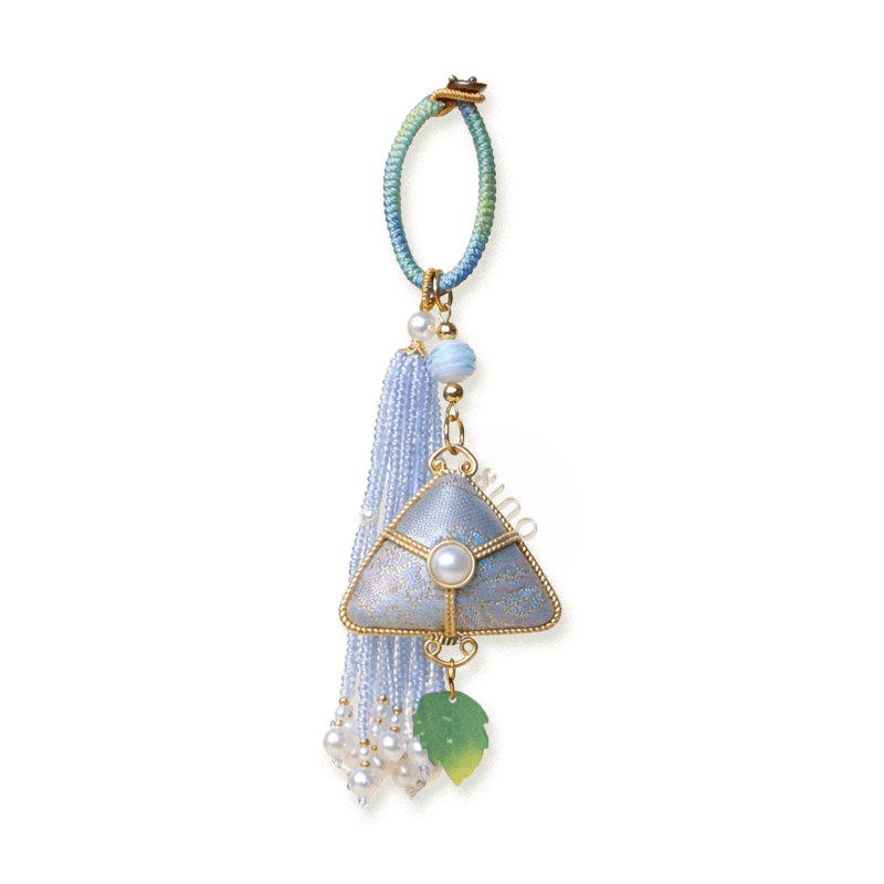 Blue Chinoiserie Song Brocade auspicious zongzi tassel bag charm with pearl tassels, gold-tone trim, and a leaf pendant.
