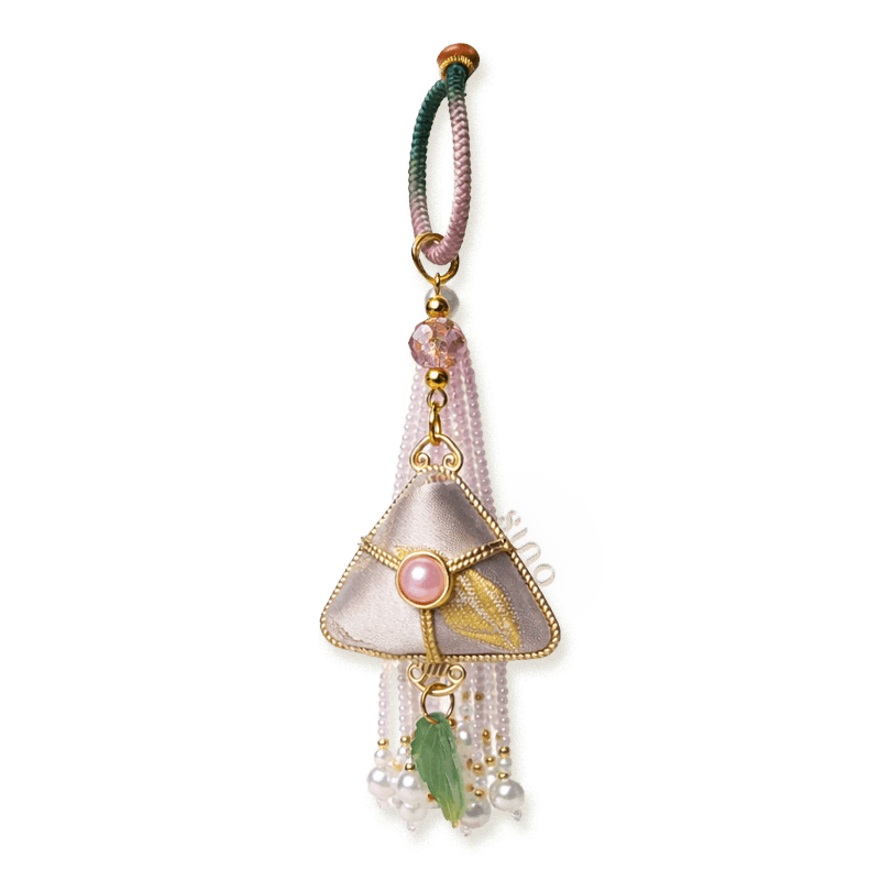 Pink Chinoiserie Song Brocade auspicious zongzi tassel bag charm with pearl tassels, gold-tone trim, and a leaf pendant.