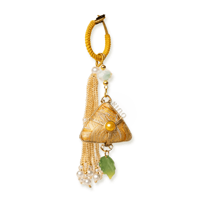 Yellow Chinoiserie Song Brocade auspicious zongzi tassel bag charm with pearl tassels, gold-tone trim, and a leaf pendant.