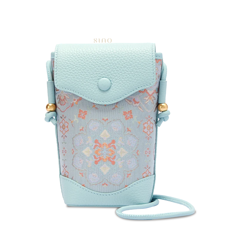 Chinoiserie Song Brocade crossbody phone bag for women with Baoxiang floral motif and light blue leather, front view.
