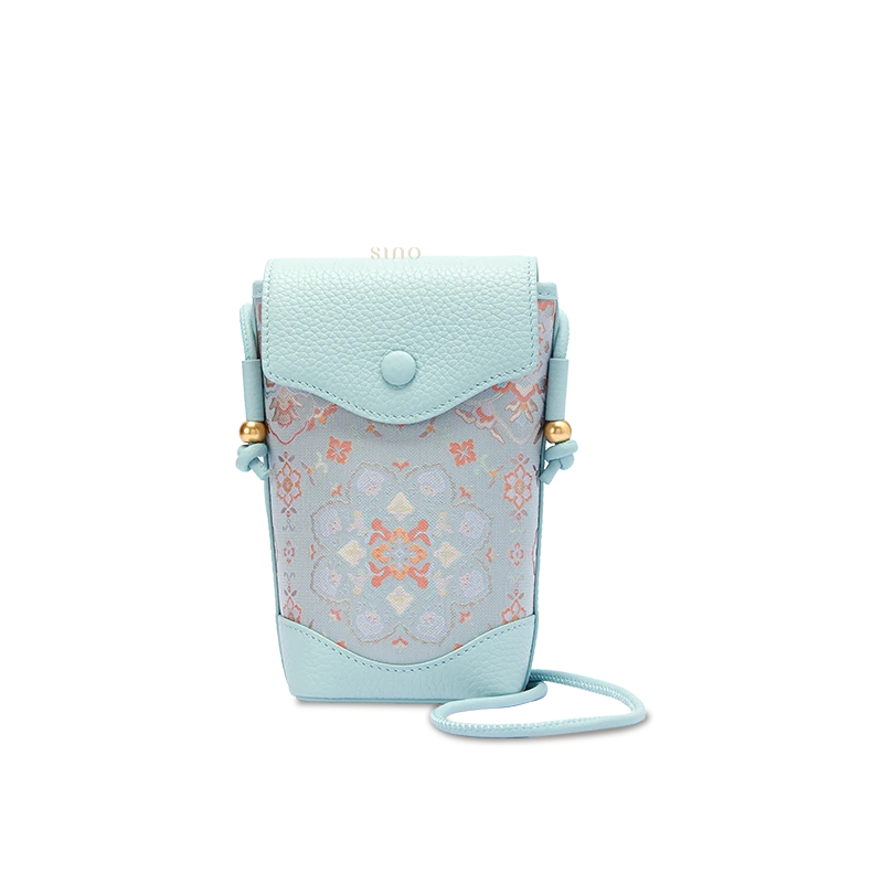 Chinoiserie Song Brocade crossbody phone bag for women with Baoxiang floral motif and light blue leather, front view.