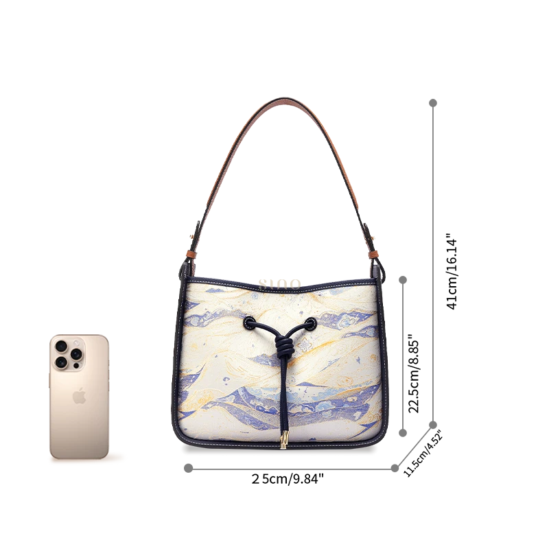 Moonlit Splendor large shoulder bag size reference shown beside a smartphone for scale.