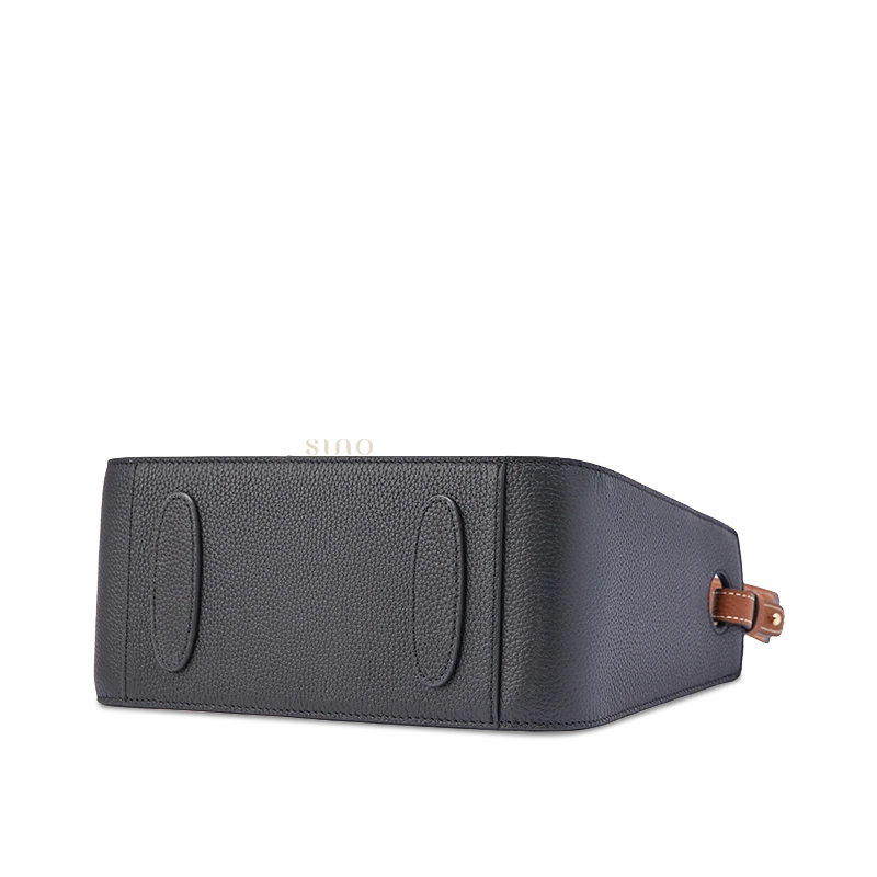 Peacock Prosperity leather shoulder bag bottom view showing the structured black leather base and reinforced construction.