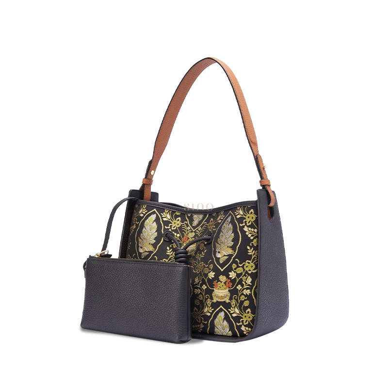 Black leather shoulder bag for women with Peacock Prosperity Song Brocade and matching pouch, angled front view.