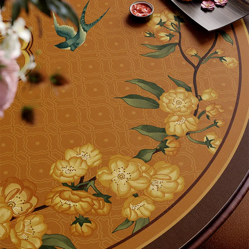 Close-up overhead: floral swallow pattern detail on round table mat.
