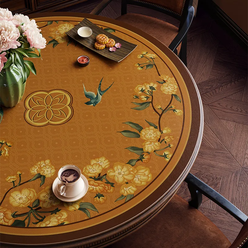 Overhead view: floral swallow table mat with teacup and pastries.
