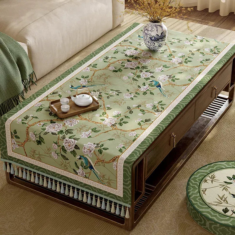 Top view of chinoiserie vintage jade green tablecloth on living room coffee table.