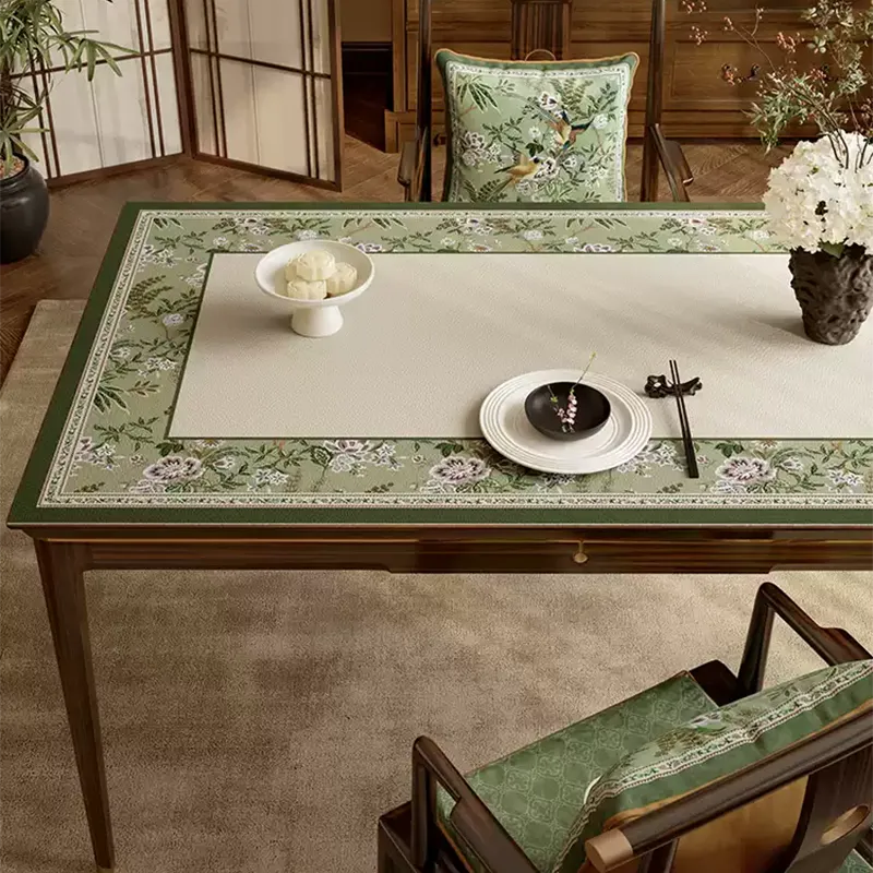 Close-up of luxury emerald green floral leather table mat pattern.