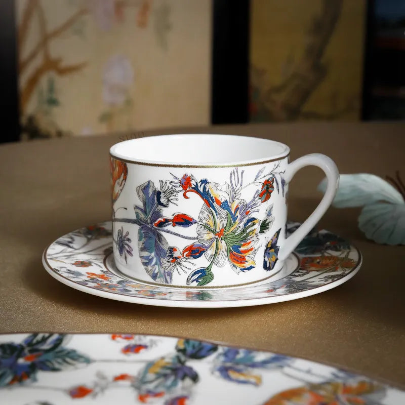 Coffee cup and saucer on table setting.