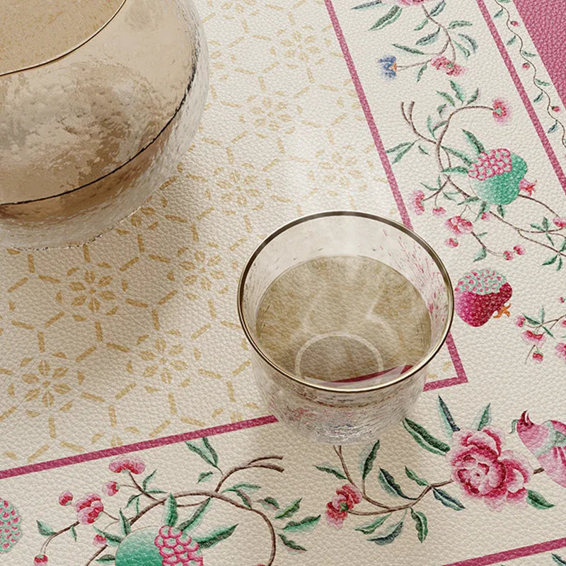 Waterproof coral pink round leather table mat surface detail.