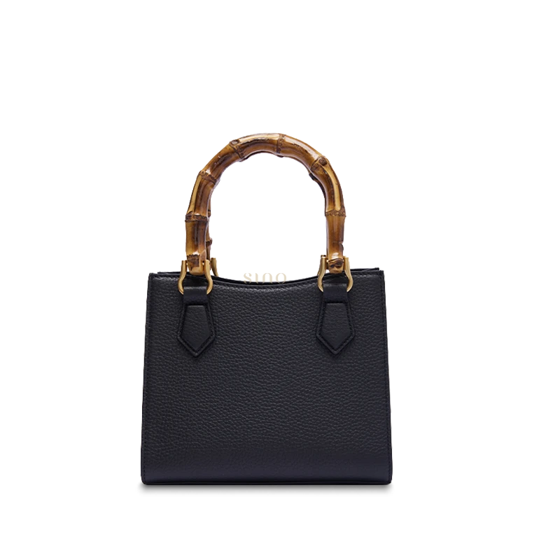 Back view of Cracked Ice Plum Blossom bamboo handle handbag featuring smooth full-grain leather finish and elegant minimalist design.