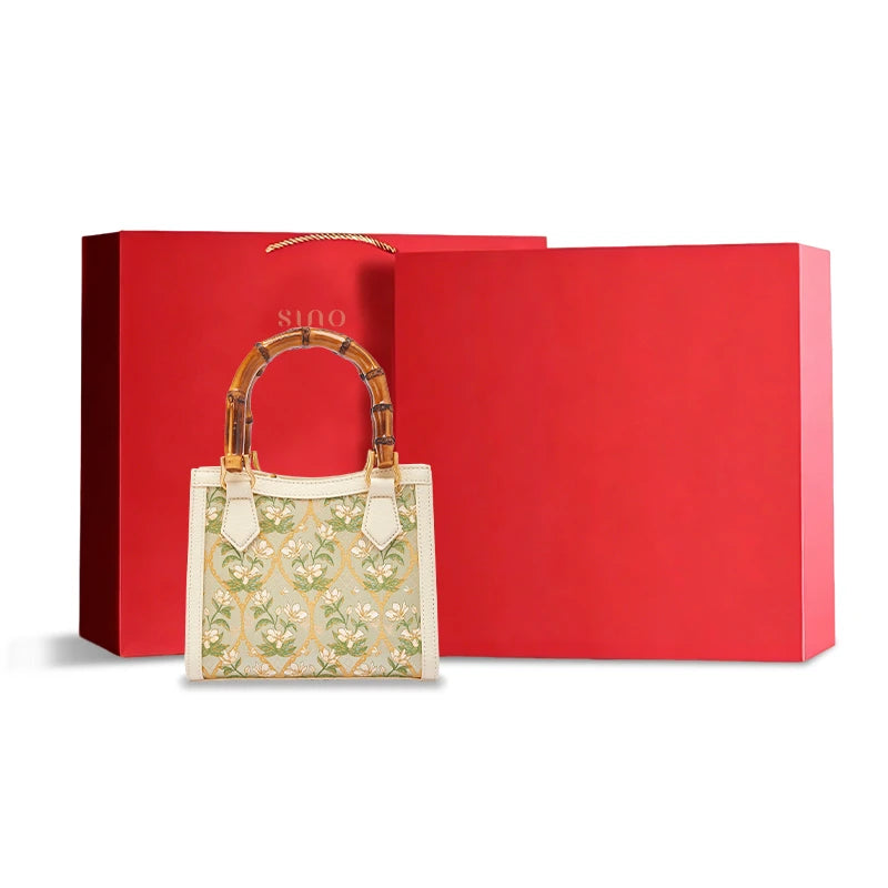 Dayun Brocade Verdant Floral leather bamboo handle handbag with elegant gift packaging, ideal as a luxury Chinese craftsmanship gift.
