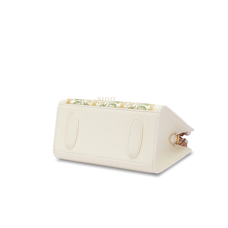 Side view of Dayun Brocade bamboo handle handbag showing structured silhouette and premium full-grain leather construction.