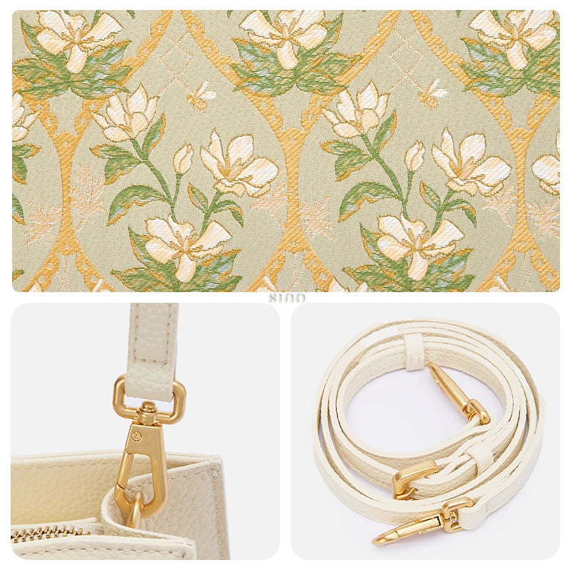 Close-up of Dayun Brocade floral textile panel, gold hardware, and leather shoulder strap details on a Chinese inspired bamboo handle handbag.