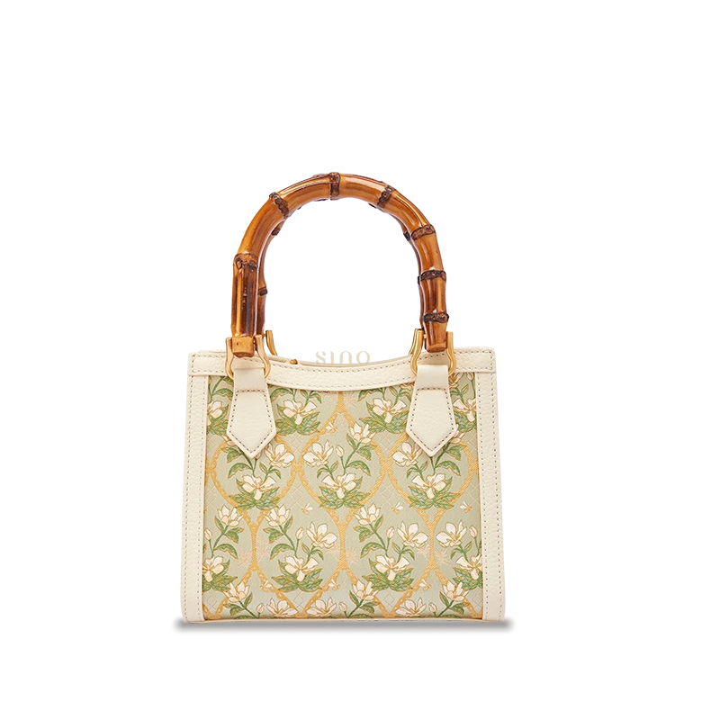 Dayun Brocade Verdant Floral leather bamboo handle handbag featuring traditional silk weaving, floral motifs, and refined handcrafted design.