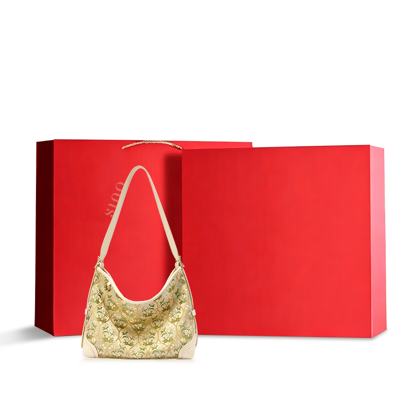Dayun Brocade Verdant Floral Leather Crossbody Bag displayed with a red gift box, ideal as a luxury Chinoiserie gift for women.