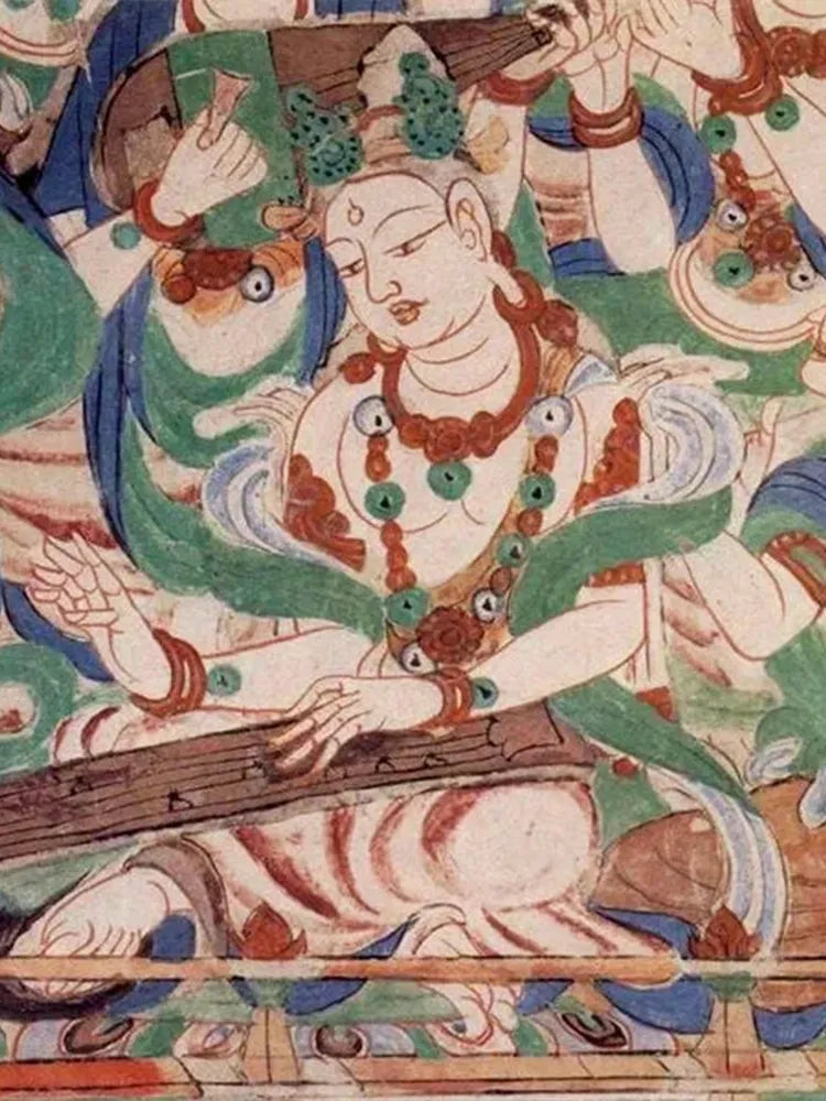 Vibrant Dunhuang mural featuring flying apsaras playing musical instruments—classic Chinese Buddhist art.