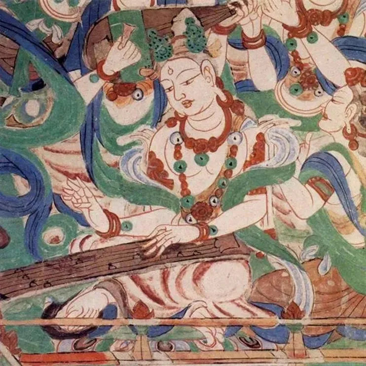 Vibrant Dunhuang mural featuring flying apsaras playing musical instruments—classic Chinese Buddhist art.