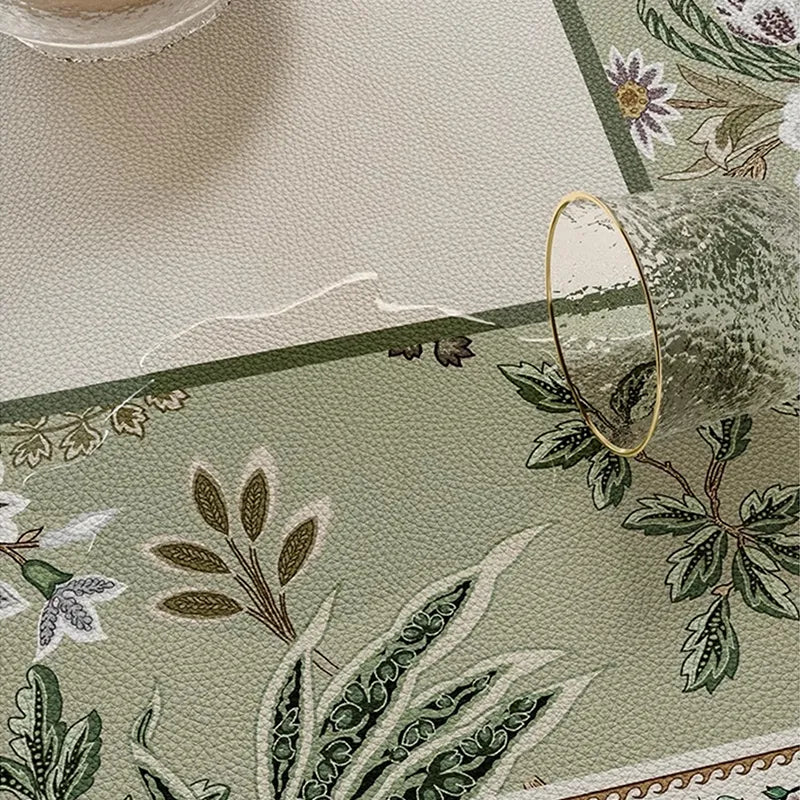 Wiping spill from chinoiserie table mat, easy clean.