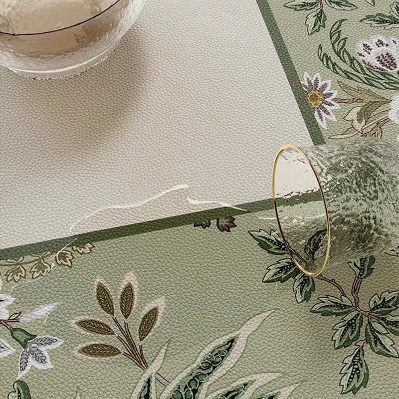 Wiping spill from chinoiserie table mat, easy clean.