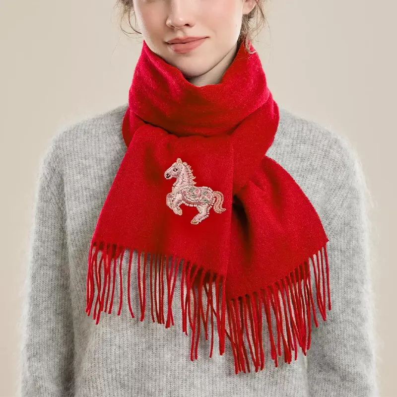 Model wearing bright red luxury wool cashmere scarf with fortune horse embroidery – versatile cold-weather accessory.