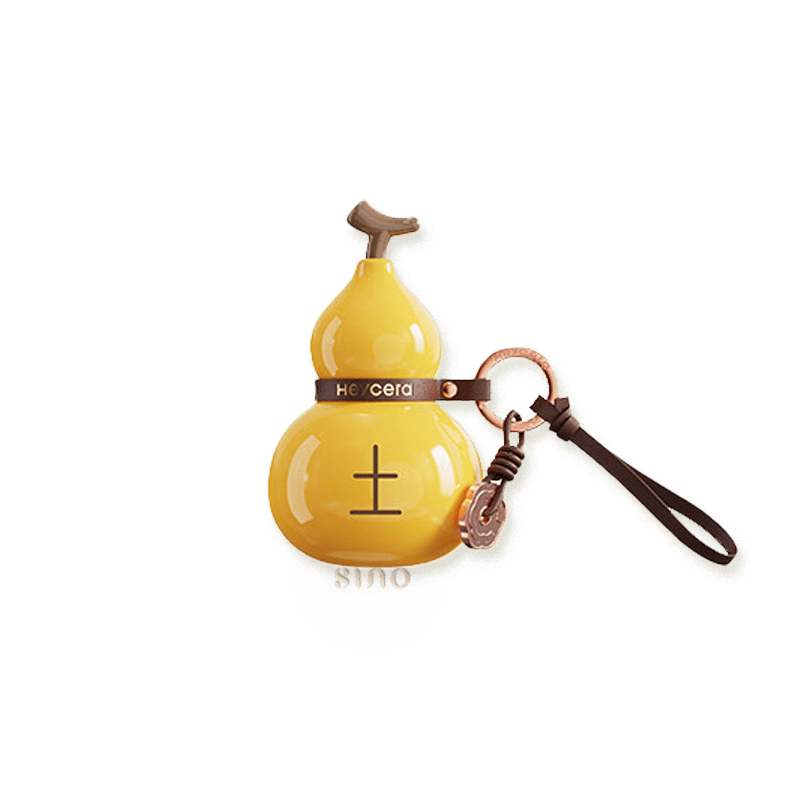 Yellow Earth element porcelain Hulu bag charm with a glossy finish, brown leather strap, and bronze-tone key ring.