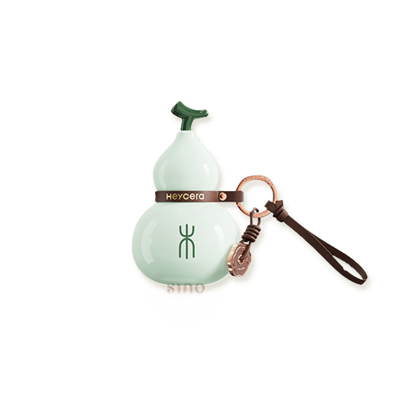 Light green Wood element porcelain Hulu bag charm with a glossy finish, Wood symbol, leather strap, and bronze-tone ring.
