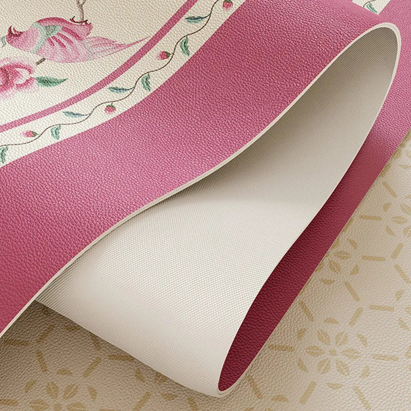 Flexible coral pink leather coffee table mat with anti-slip backing.