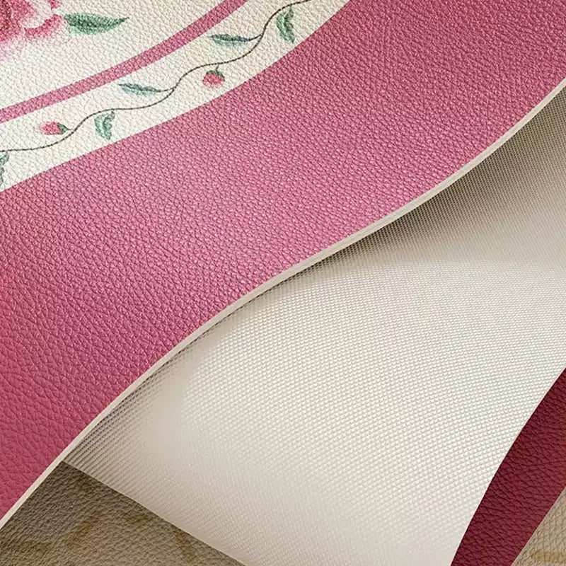 Flexible coral pink leather table mat with anti-slip backing.