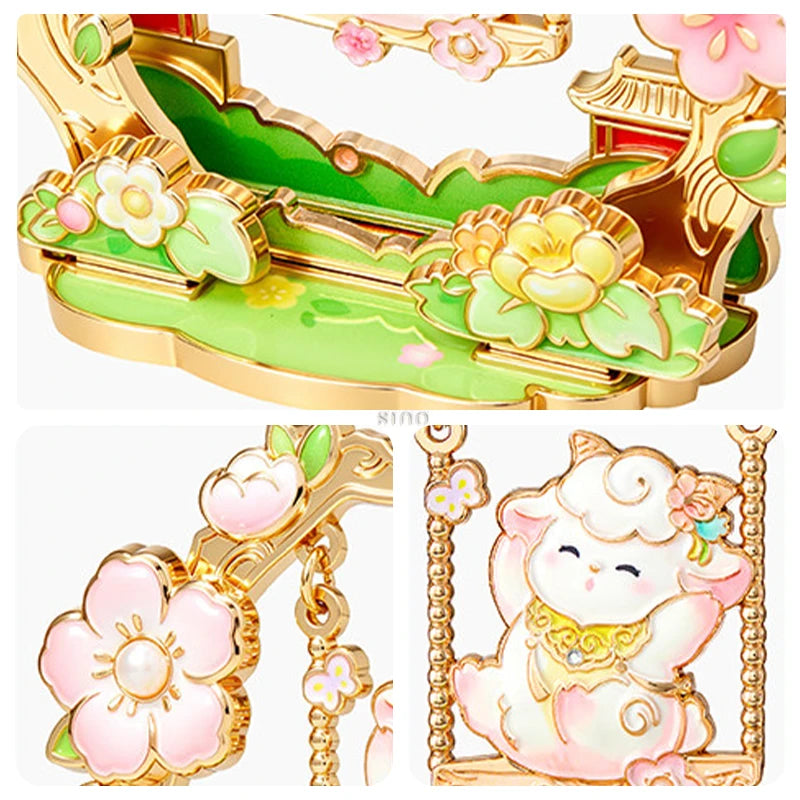 Close-up of a Year of the Goat fridge magnet featuring a cute sheep on a floral swing, colorful enamel flowers, and gold-tone detailing.