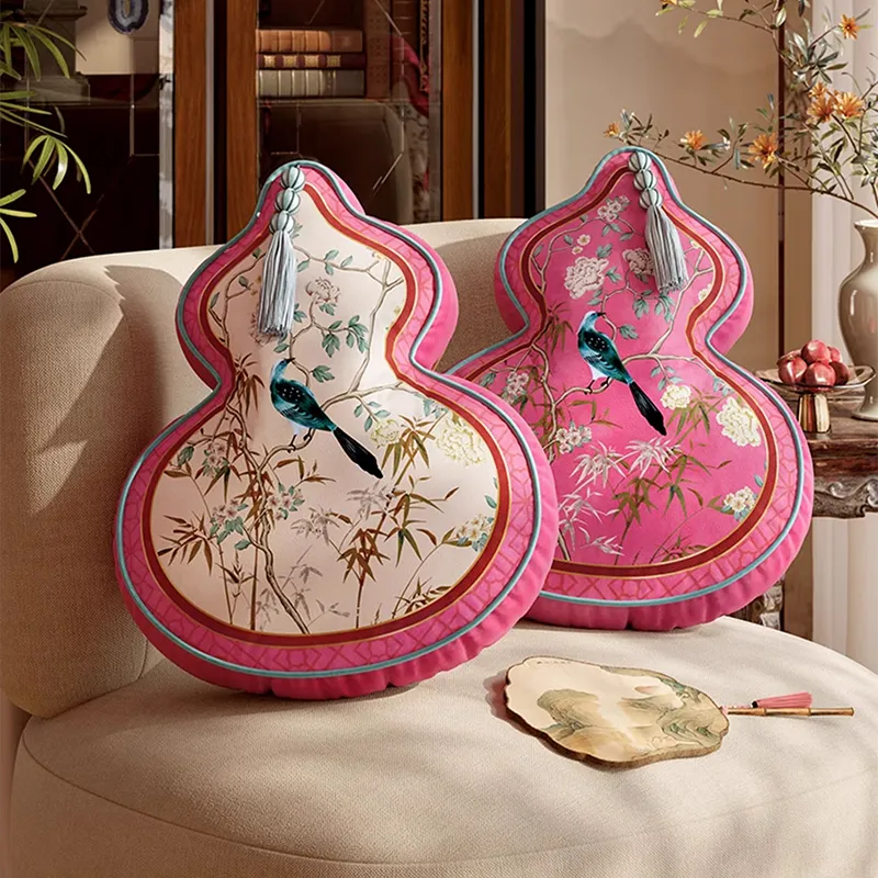 Gourd style A and B chinoiserie window lattice pillows on sofa.