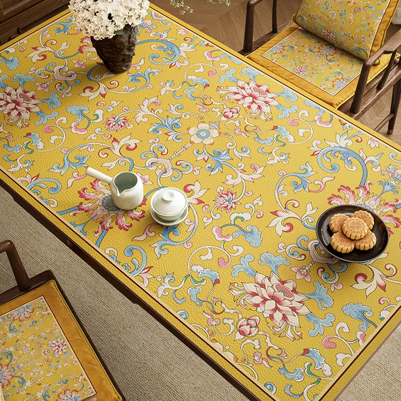 Close-up overhead of imperial yellow enamel floral pattern.