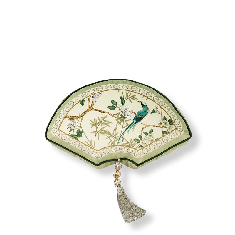 Fan-shaped luxury chinoiserie jade green decorative throw pillow on white background.