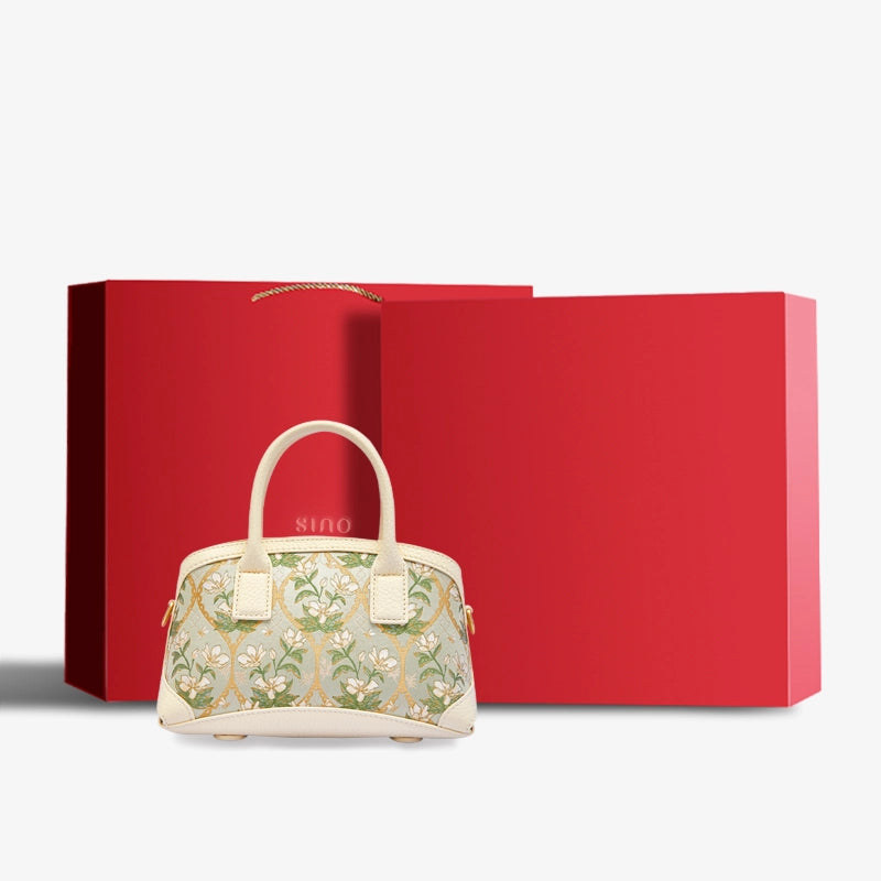 Luxury Dayun Brocade Verdant Floral top handle bag displayed with elegant red gift box packaging.