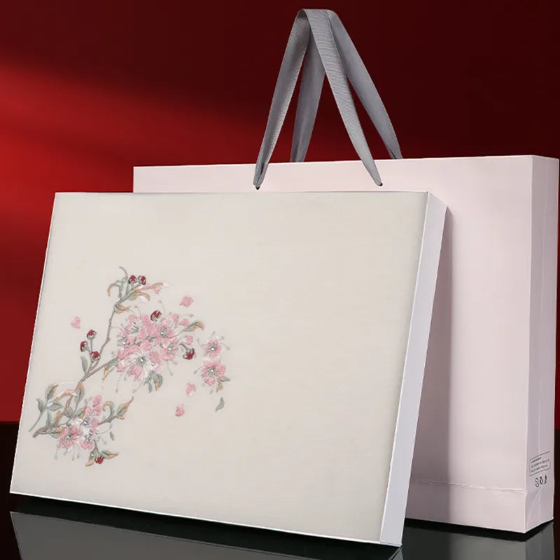 Premium gift box packaging for camellia cashmere scarf.