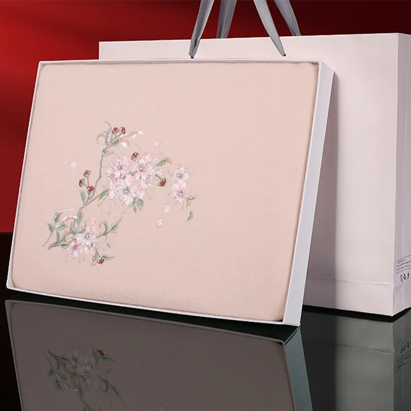 Elegant gift box packaging for plum blossom cashmere scarf, premium presentation.