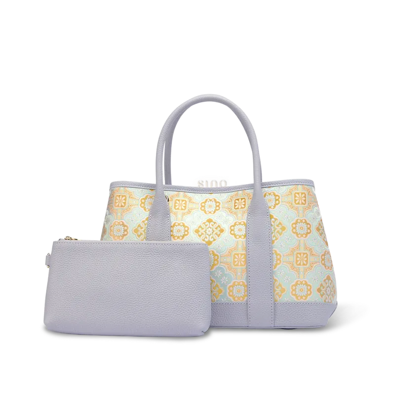 Front view of luxury gold-woven Song brocade Ruyi motif tote bag with purple inner pouch on white background.