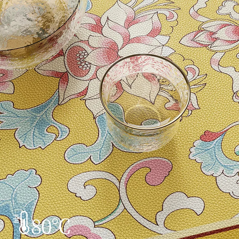 Heat-resistant imperial yellow table mat with 80°C cup.