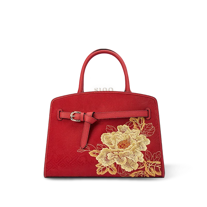 Luxury red peony embroidered Xiangyunsha leather top handle bag with gold floral embroidery front view.