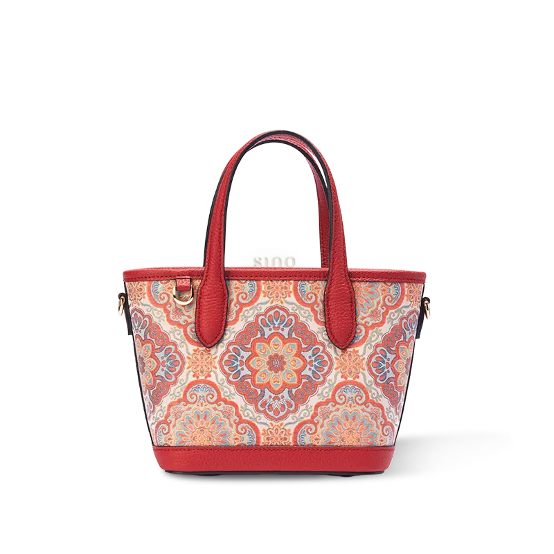 Front view of luxury red Song brocade Baoxiang motif top-handle bag on white background.