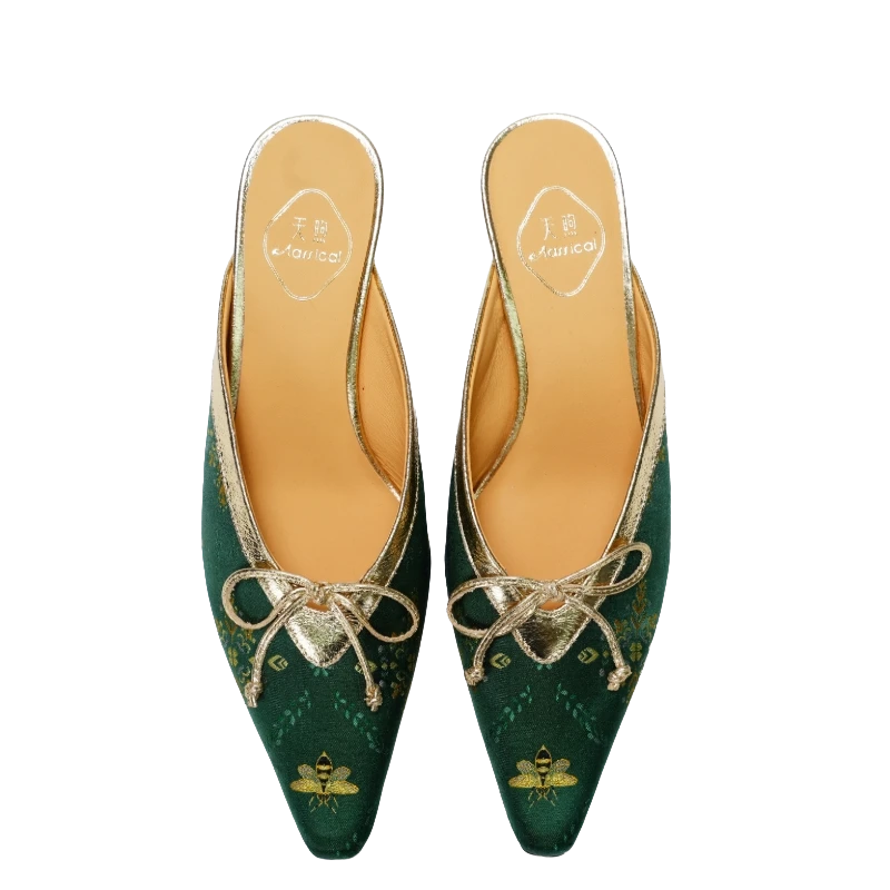 Transparent top view of Luxury Shu Brocade Emerald Gilded Butterfly kitten heel mules for women featuring emerald green brocade fabric, golden butterfly motifs, pointed toes, bow details, and refined Chinese craftsmanship.