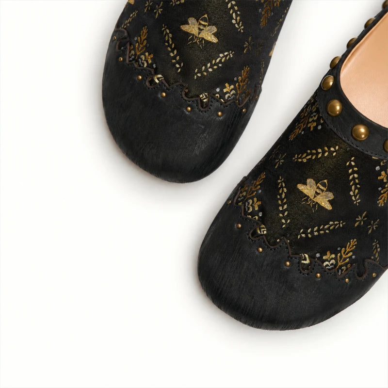 Luxury Shu Brocade Gilded Butterfly mules featuring a close-up view of the black silk upper, golden butterfly embroidery, and handcrafted decorative details.