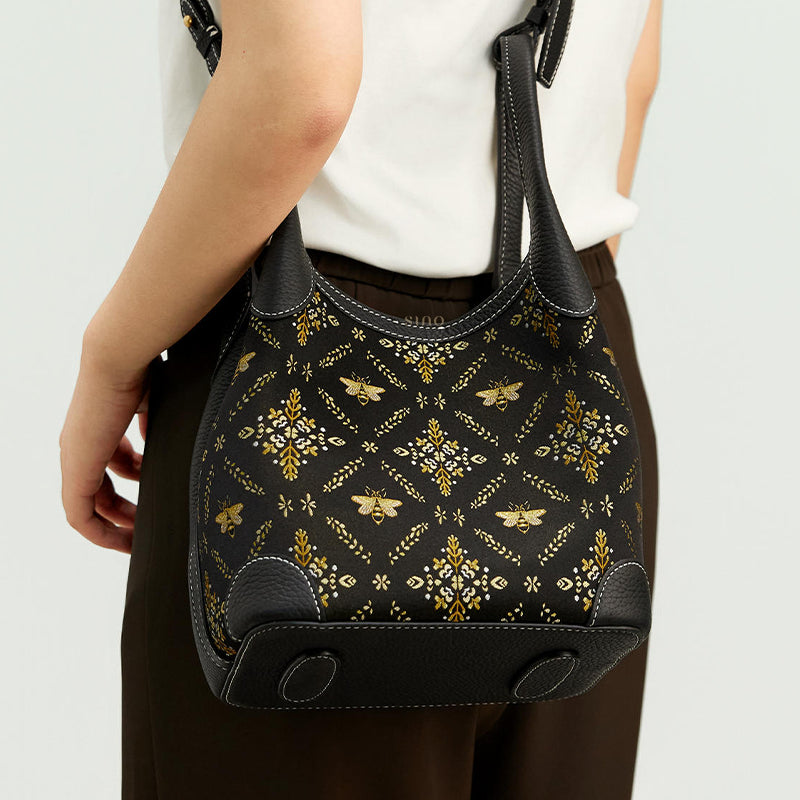 Back model view of the Luxury Shu Brocade Gilded Jade Leather Basket Tote Bag, showing the black brocade pattern, leather base, and compact basket tote silhouette.