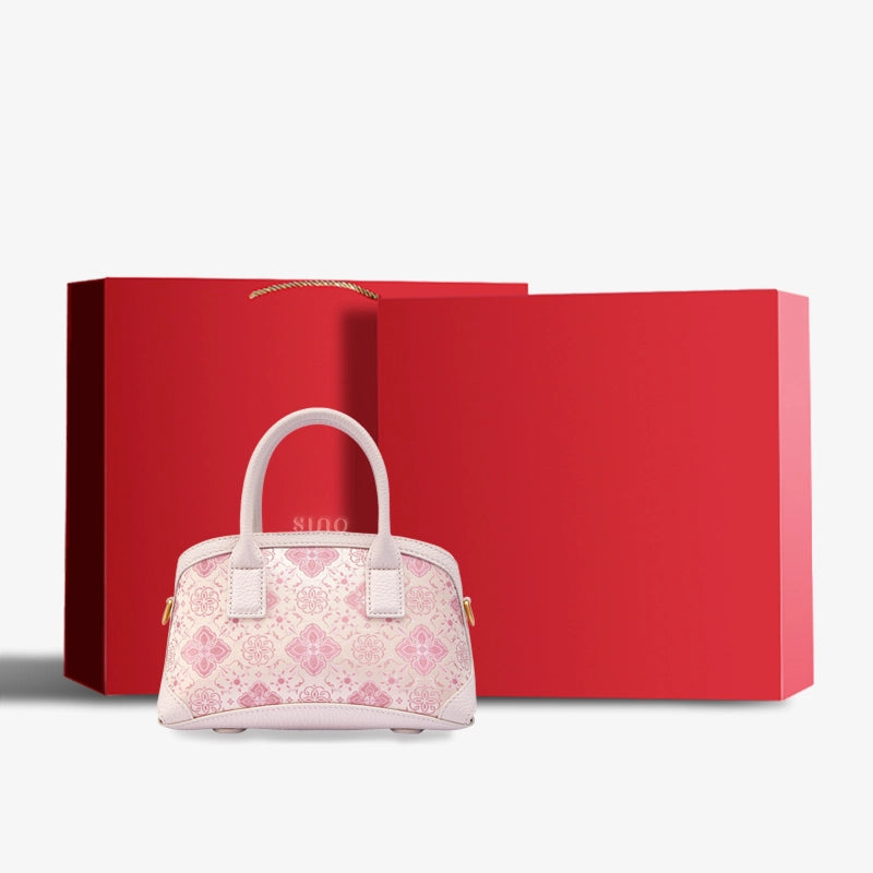 Luxury Shu Brocade Pink Persimmon Calyx Leather Top Handle Bag displayed with premium gift box packaging.